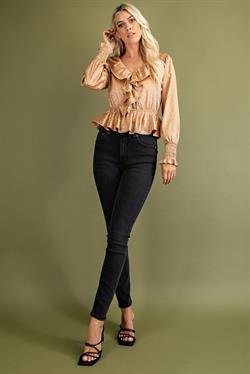 Stylish taupe printed ruffle peplum top paired with black jeans, showcasing coastal boutique clothing for trendy women.