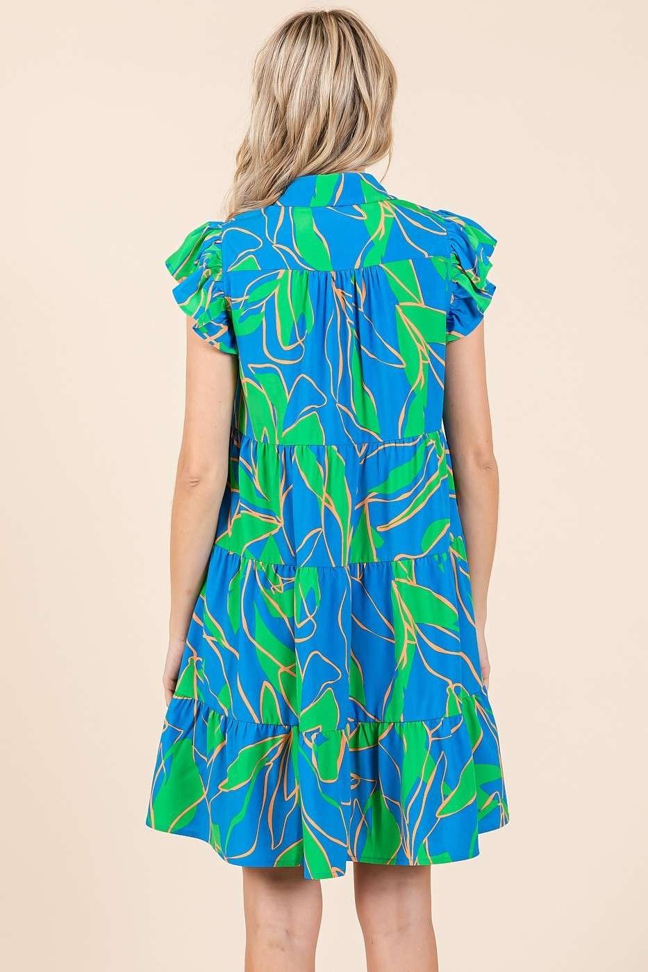 Lola Dress in bright blue and green, perfect for tropical vacations, available at Port Aransas coastal boutique.
