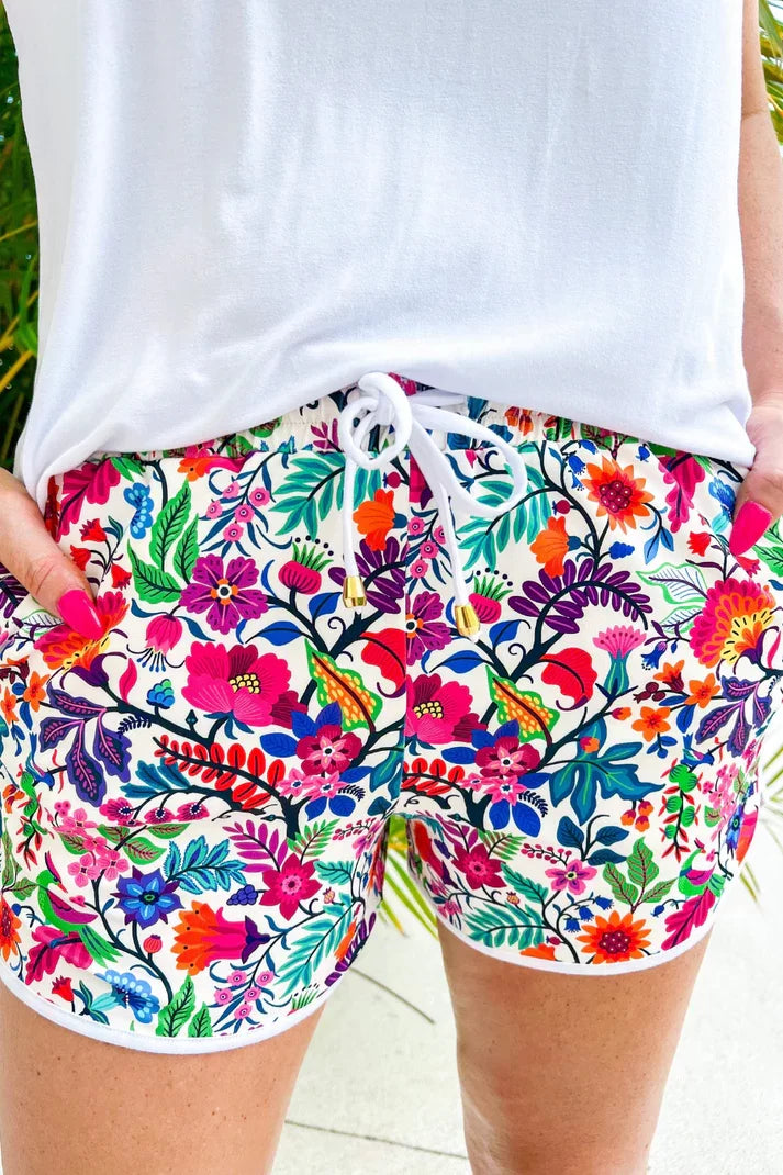 Fiesta Time Shorts by Raggdoll Boutique featuring vibrant floral design, perfect for summer outfits Texas.