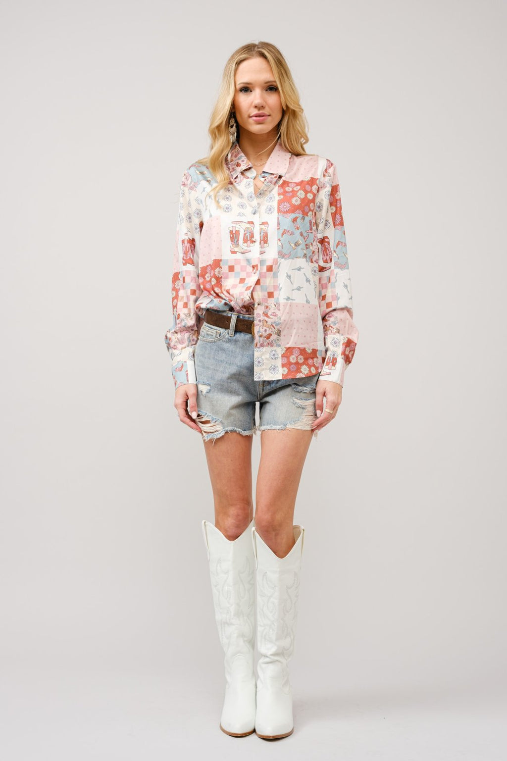 Stylish Western motif button front top paired with denim shorts and white cowgirl boots, perfect for coastal boutique clothing.