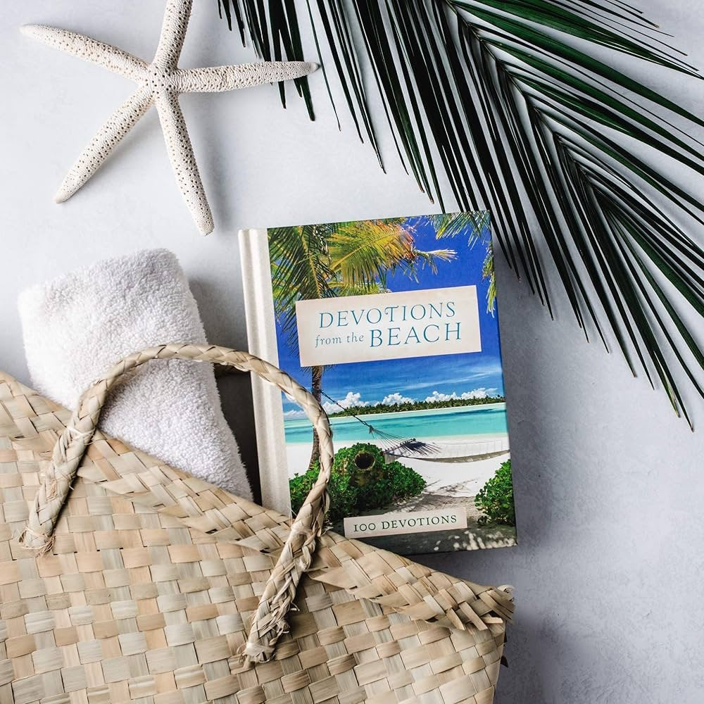 Beach-themed devotional book, towel, and woven bag, perfect for coastal fashion and summer outfits.