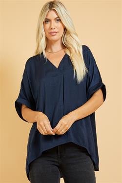Model wearing NAVY SATIN HI-LO TOP from Raggdoll Boutique, perfect for trendy coastal style and summer outfits.