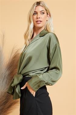 Model wearing OLIVE TIE-FRONT TOP, showcasing trendy coastal style from Raggdoll Boutique.
