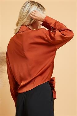 RUST SATIN TIE-FRONT TOP showcased by Raggdoll Boutique in trendy coastal style, perfect for summer outfits Texas.