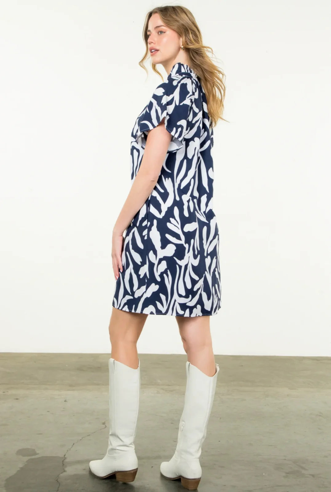 Navy short sleeve Lorna dress with bold print, ideal for coastal outings, found at Port Aransas boutique.
