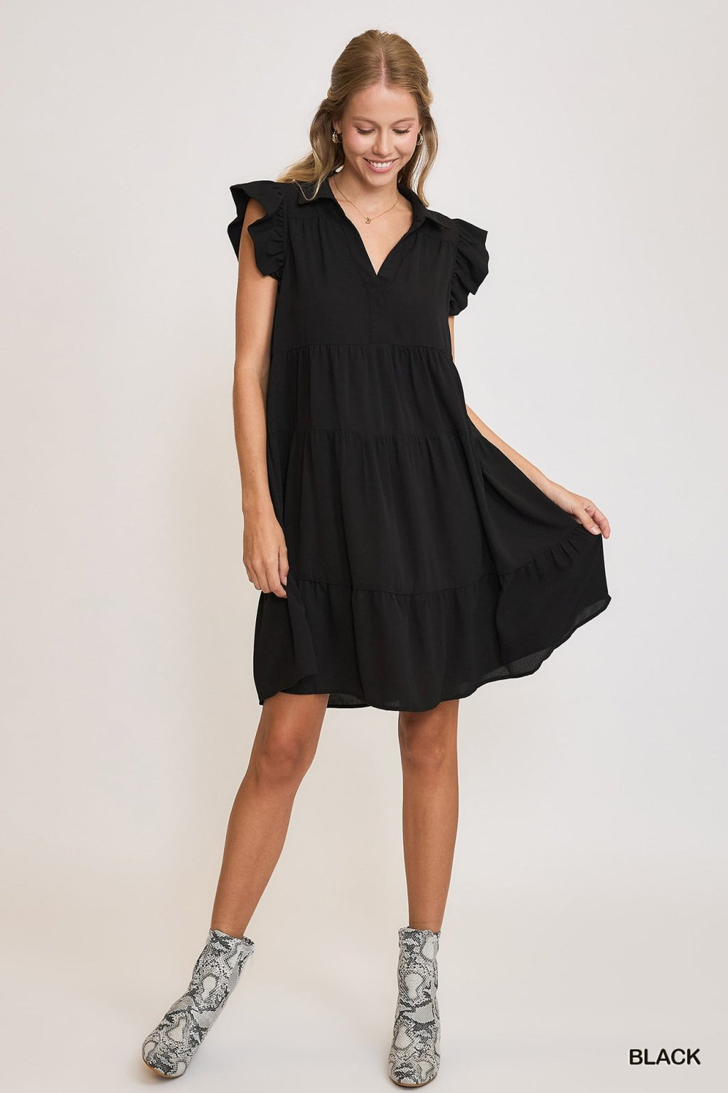 Chic black ruffle sleeve tiered dress, perfect for coastal boutique clothing and tropical vacation outfits.