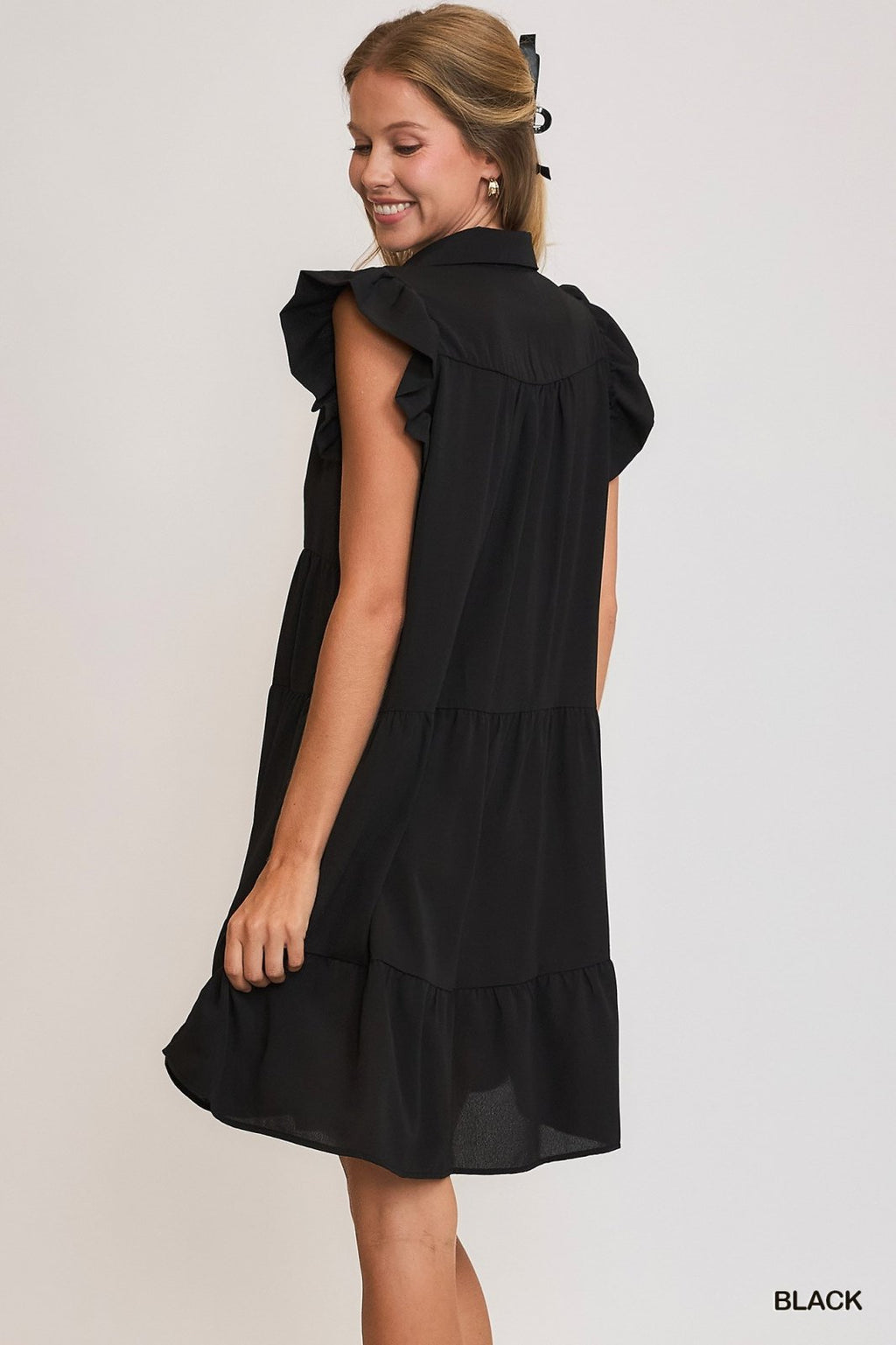 Stylish Black Ruffle Sleeve Tiered Dress from a coastal boutique, perfect for tropical vacations and curvy plus size fashion.