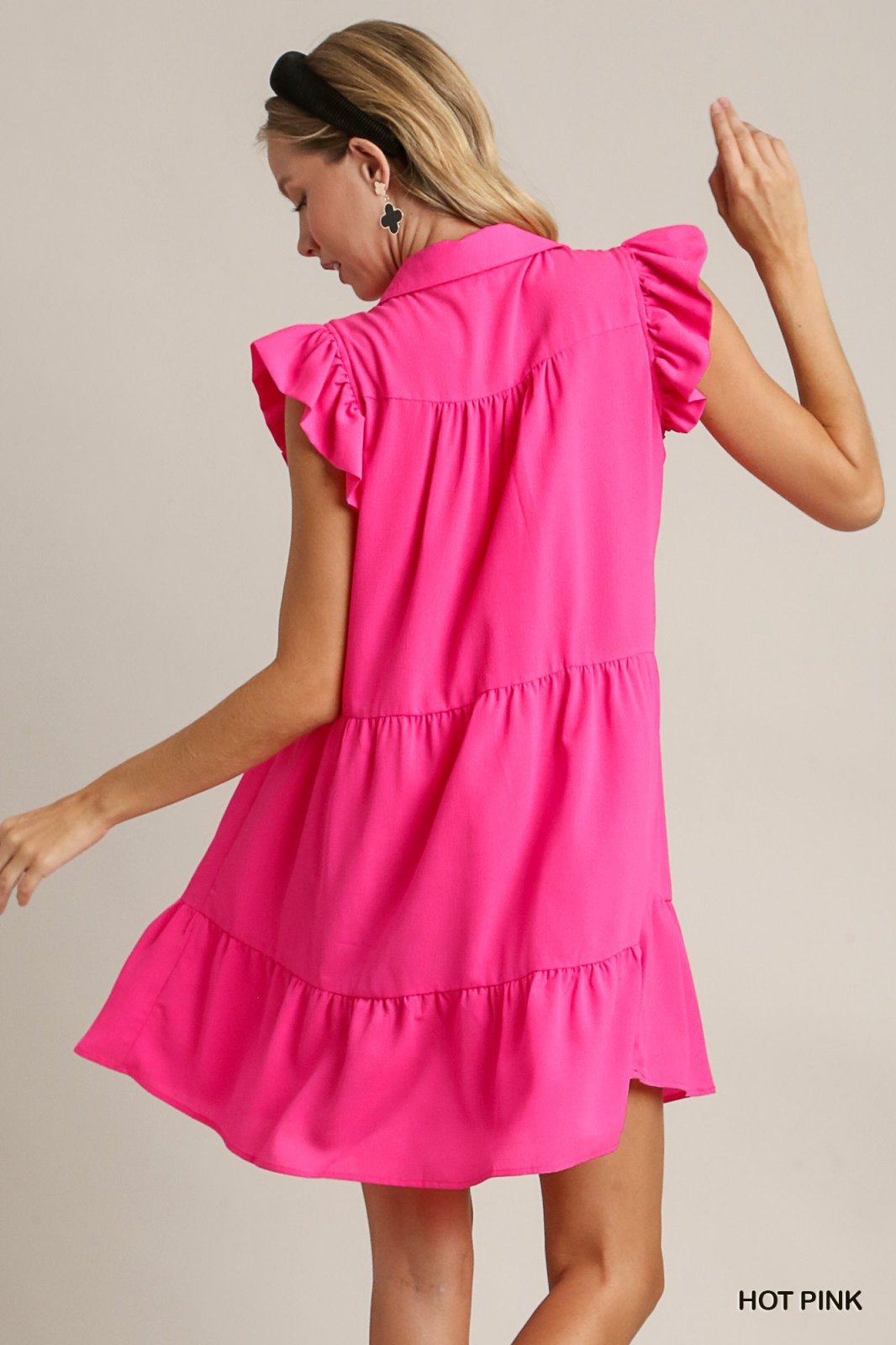 Hot pink ruffle sleeve tiered dress from a coastal boutique, perfect beach dress for summer outings and tropical vacations.