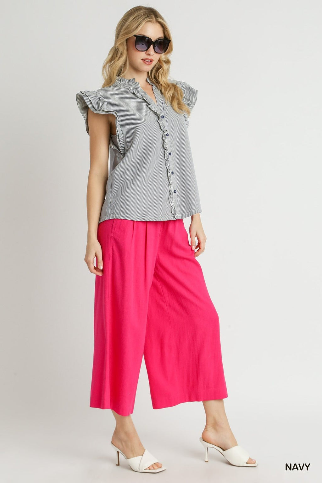 Model showcasing a Navy and White Stripe Top paired with pink culottes from Raggdoll Boutique, embodying trendy coastal style.