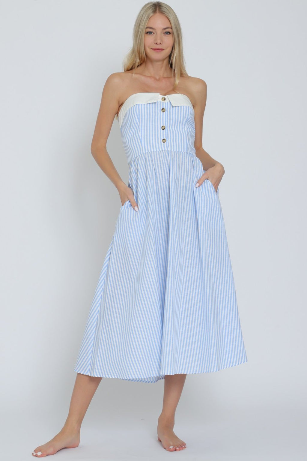 Light blue and white striped tube midi dress, perfect for coastal boutique clothing and beach dresses, ideal for tropical vacations.