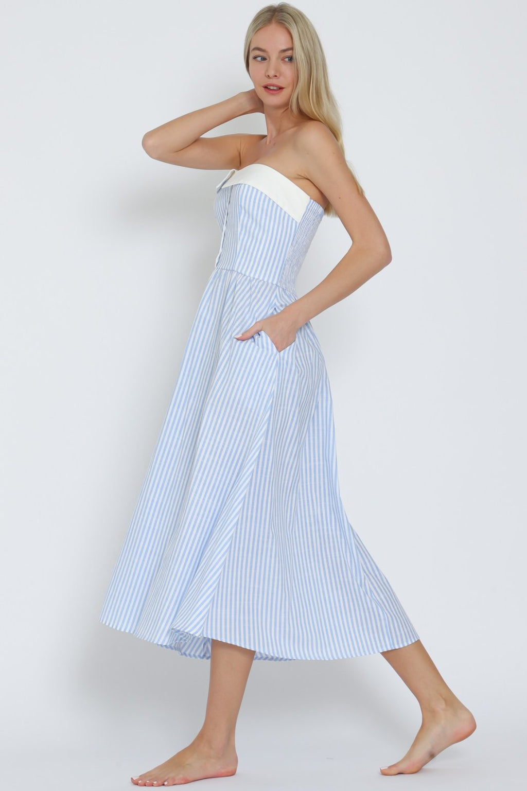 Light blue and white striped tube midi dress, perfect for beach days and tropical vacations, from a Port Aransas boutique.