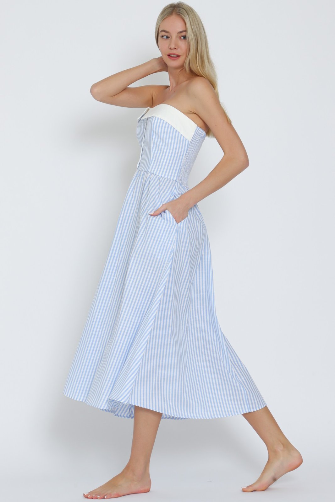 Light blue and white striped tube midi dress, perfect for beach days and tropical vacations, from a Port Aransas boutique.