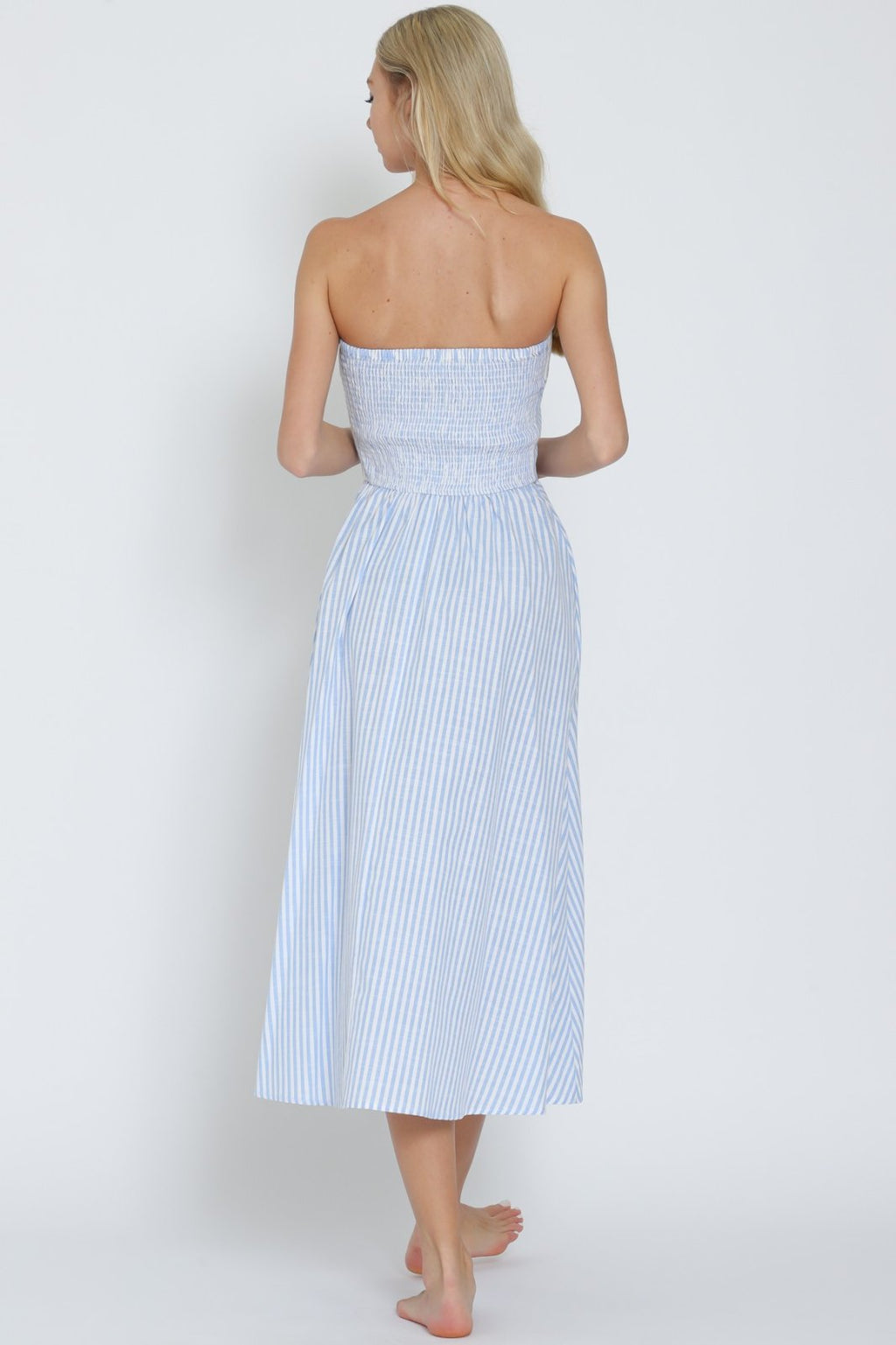 Back view of light blue and white tube button-down midi dress, perfect for coastal boutique clothing and tropical vacation dresses.