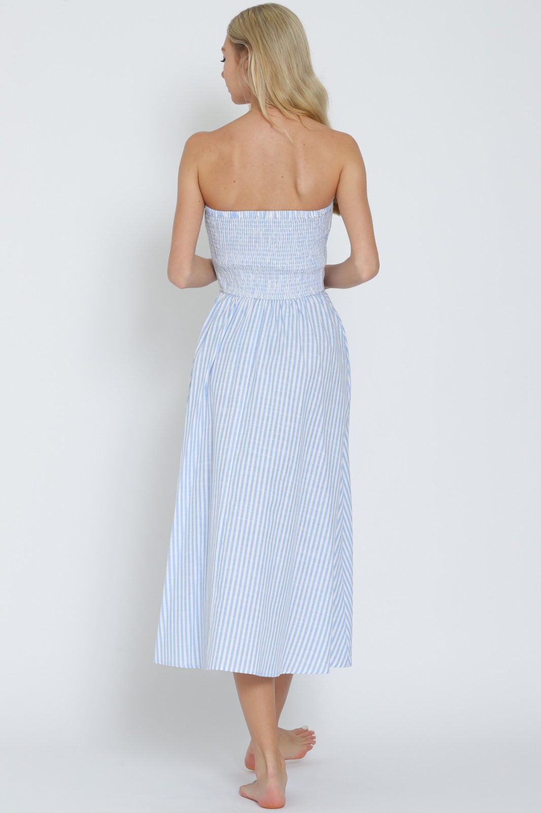 Back view of light blue and white tube button-down midi dress, perfect for coastal boutique clothing and tropical vacation dresses.