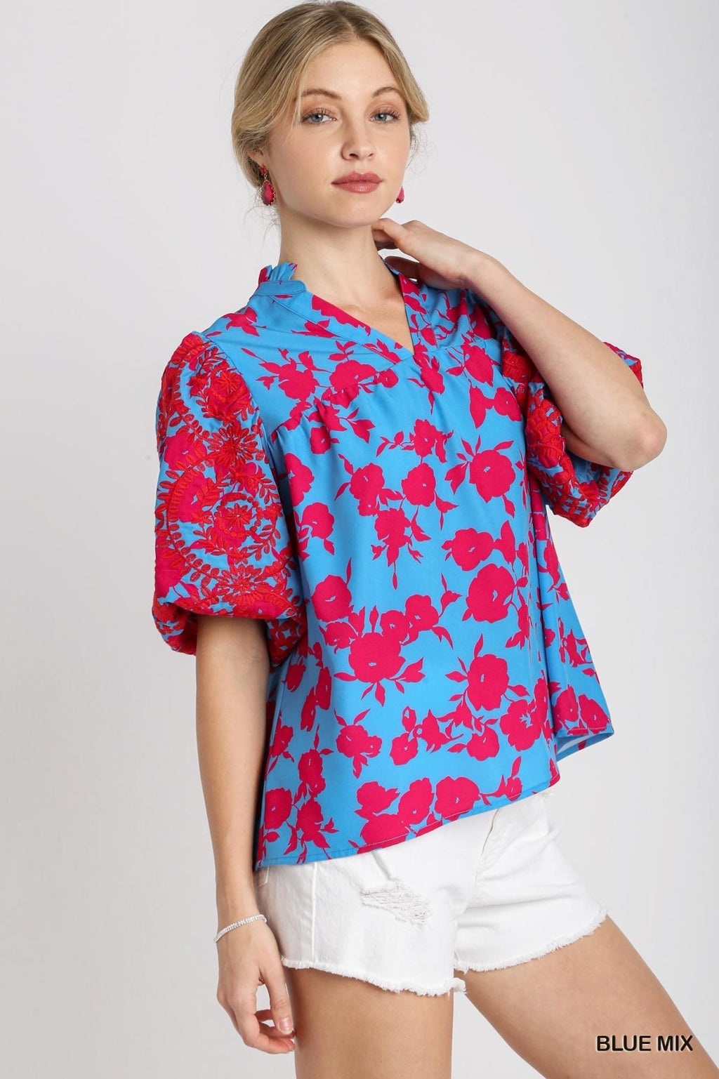 Chic blue floral split neck top with puff sleeves, perfect for coastal boutique clothing and curated women's fashion.