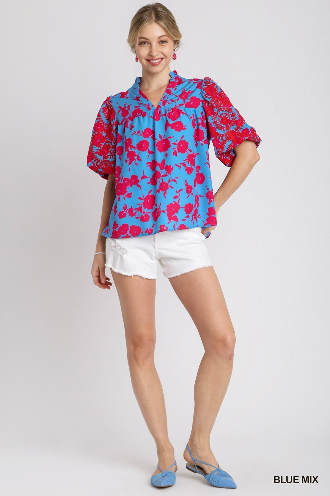 Lori Top in blue mix with floral print, stylish for casual wear, from a Port Aransas boutique, ideal for tropical vacations.