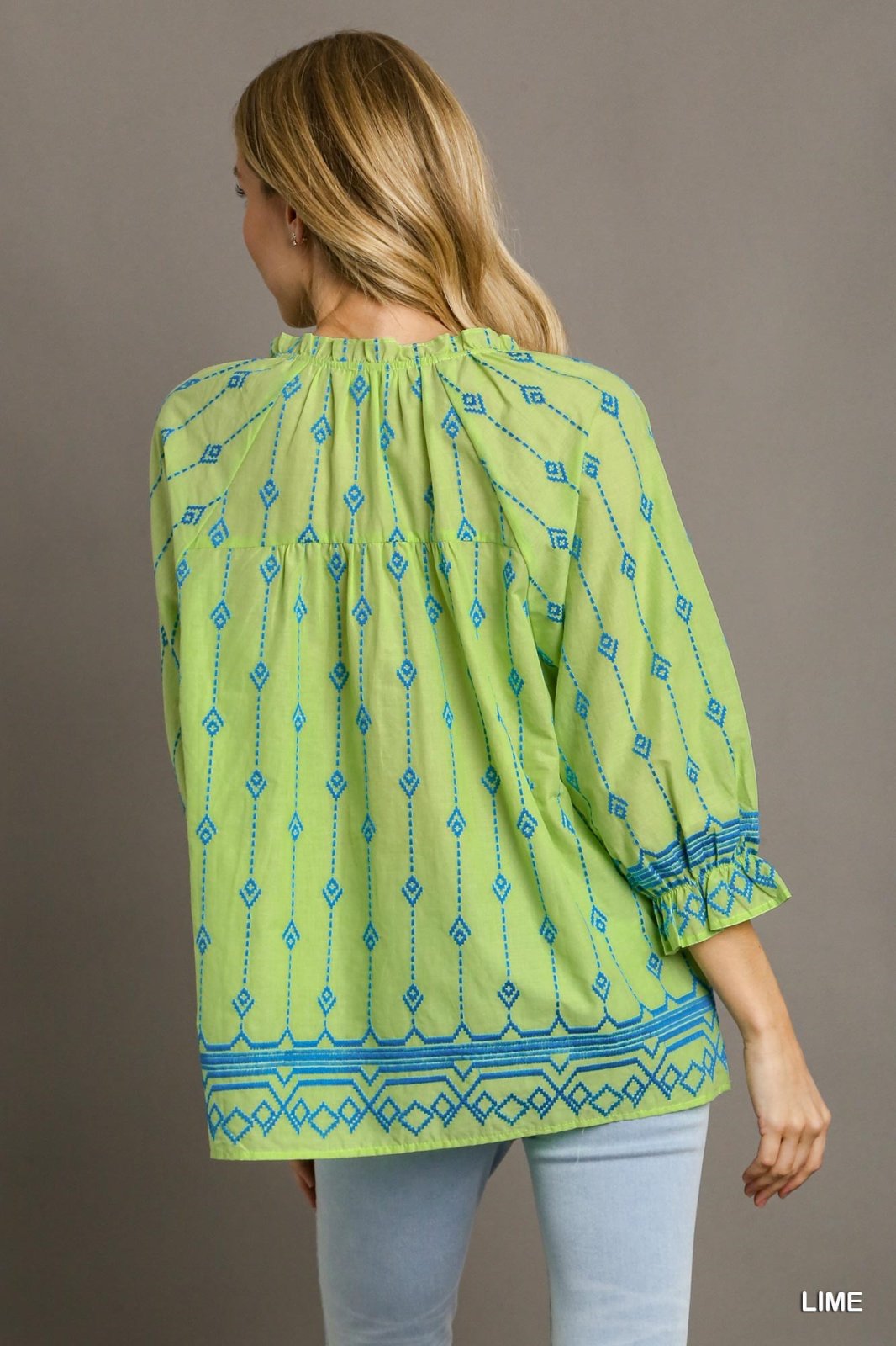 Back view of Lime and Blue Embroidered Top from Raggdoll Boutique, showcasing trendy coastal style and summer outfits Texas.