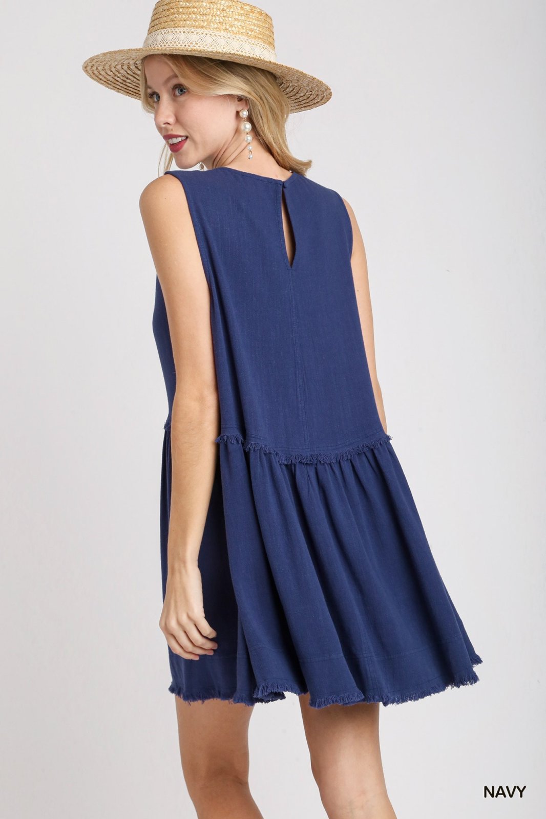 Laurel Dress featuring a navy color, perfect for trendy coastal style from Raggdoll Boutique.