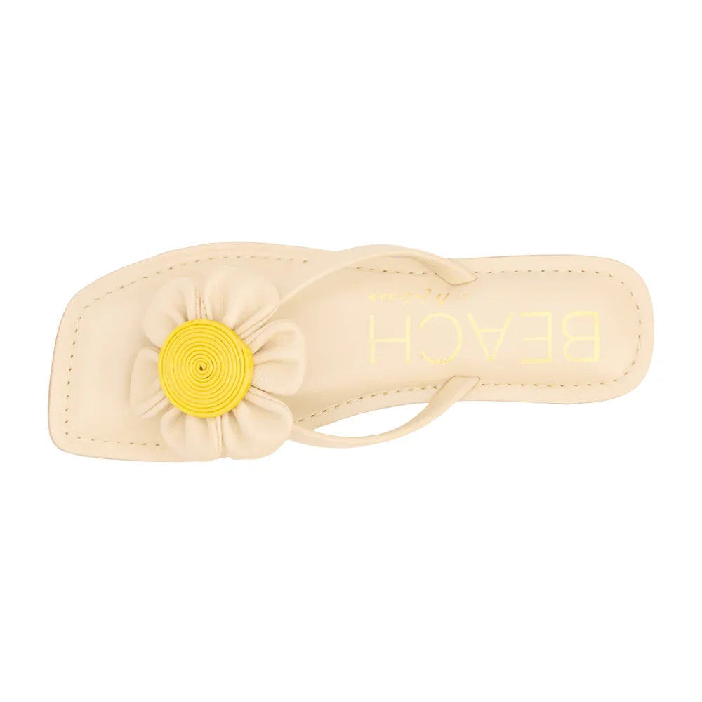 Chic square toe flip flop sandals with yellow flower appliqué, perfect for coastal boutique clothing and Port Aransas style.