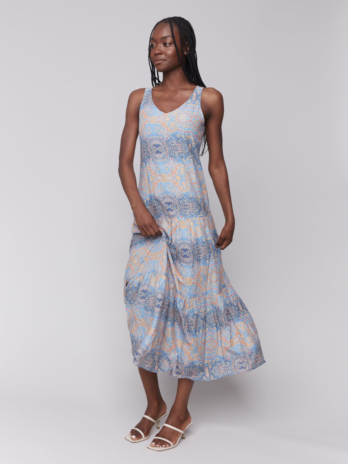 Papaya maxi dress suitable for coastal boutique clothing and tropical vacations, perfect for summer getaways and beach outings.