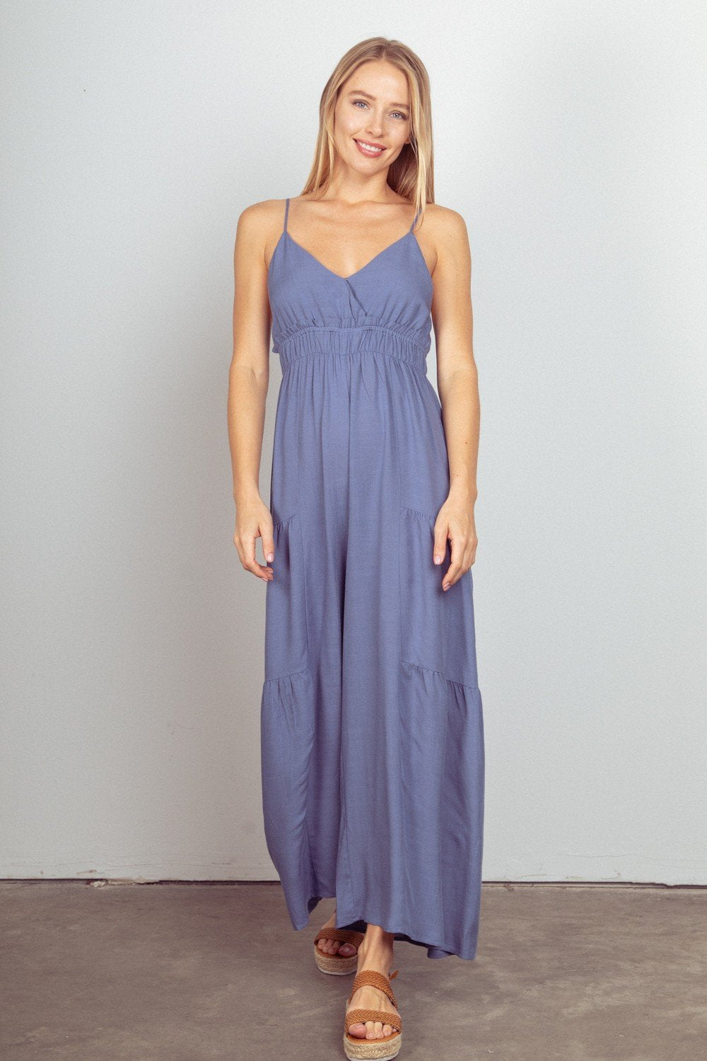 DENIM BLUE JUMPSUIT modeled by a woman in a coastal fashion boutique setting, perfect for summer outfits Texas.