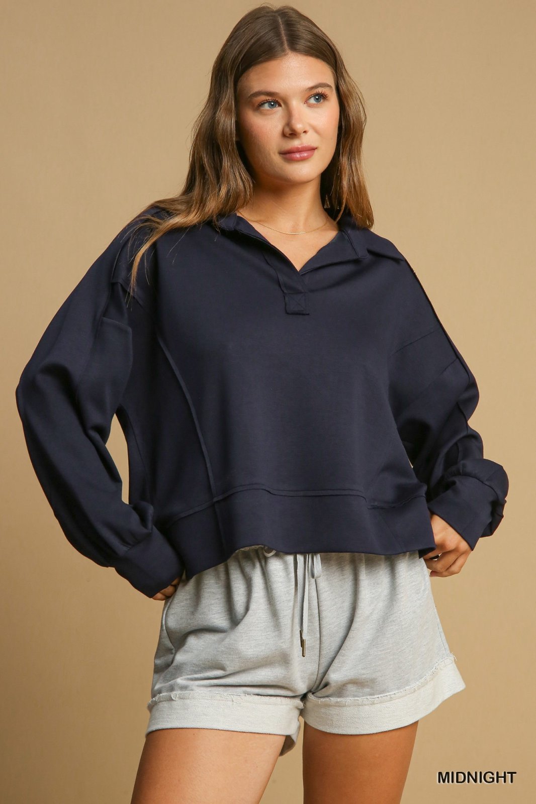 Model in MIDNIGHT JOGGING SUIT, a stylish coastal boutique clothing combo for casual beach outings.