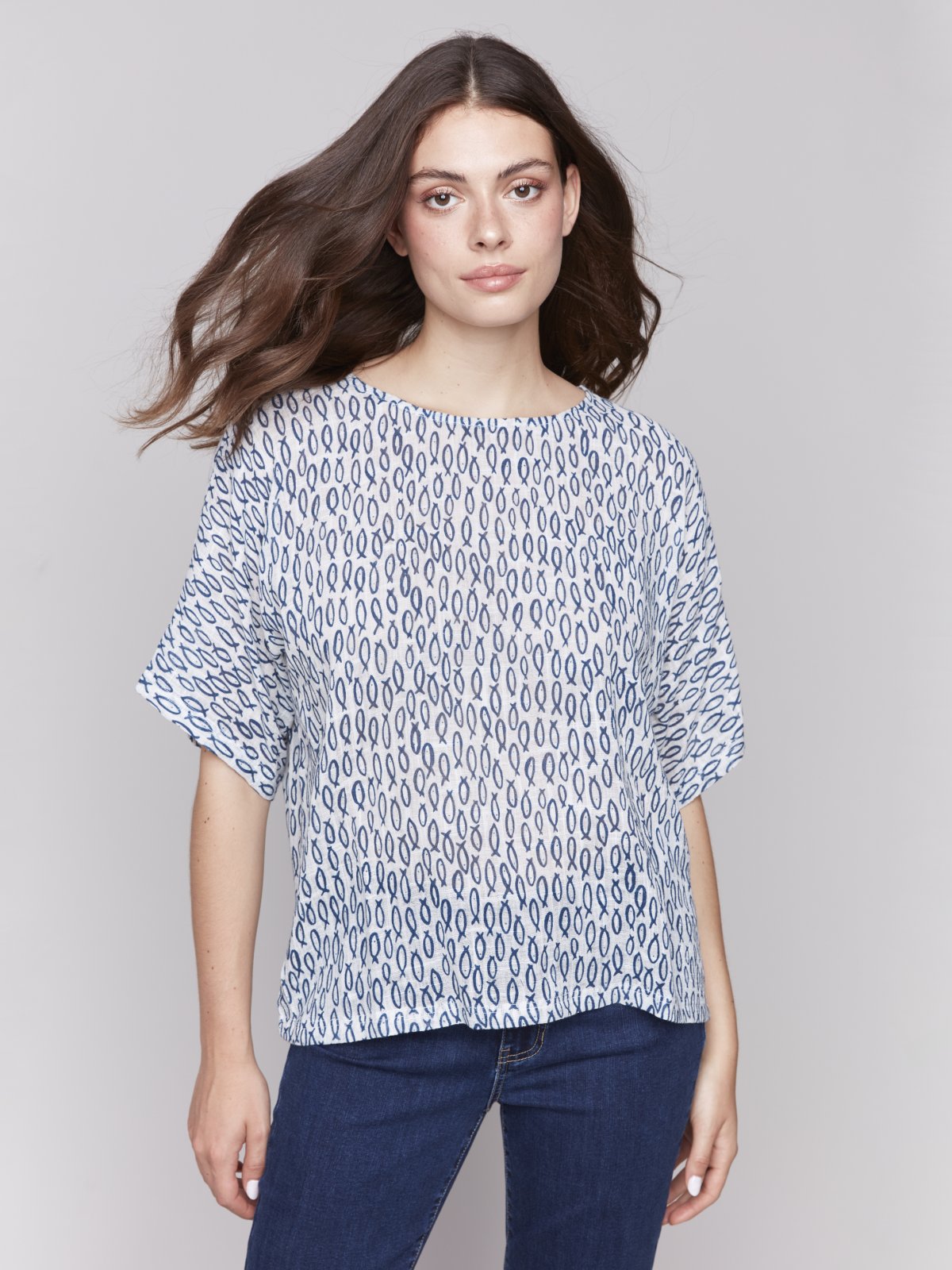 Stylish dolman blouse from a coastal boutique, perfect for summer days at the beach and curated women's fashion.