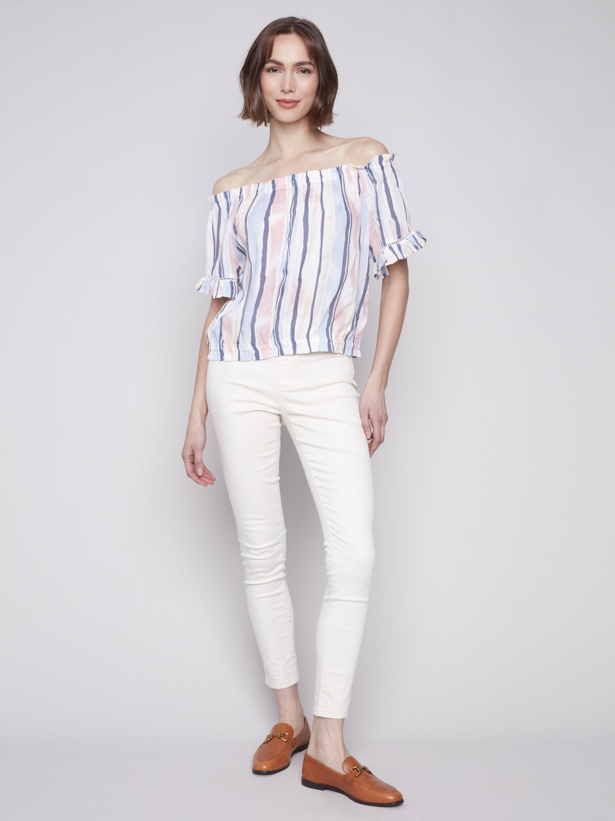 Stylish off-shoulder pink/blue striped top paired with white pants, ideal for beach dresses at our Port Aransas boutique.