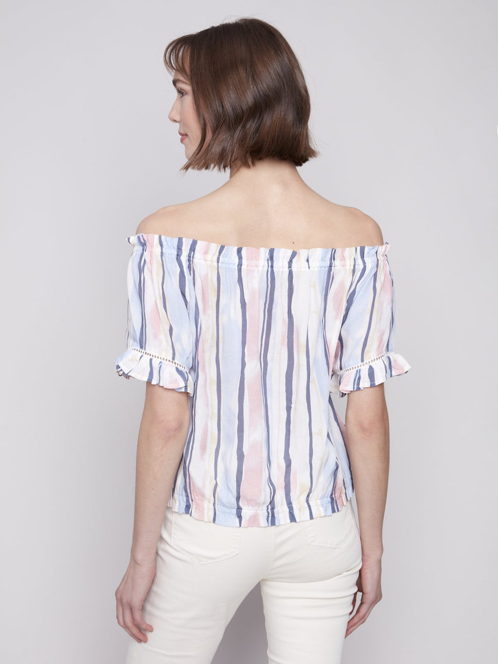 Stylish pink and blue striped top for women, perfect for coastal boutique clothing and tropical vacations.
