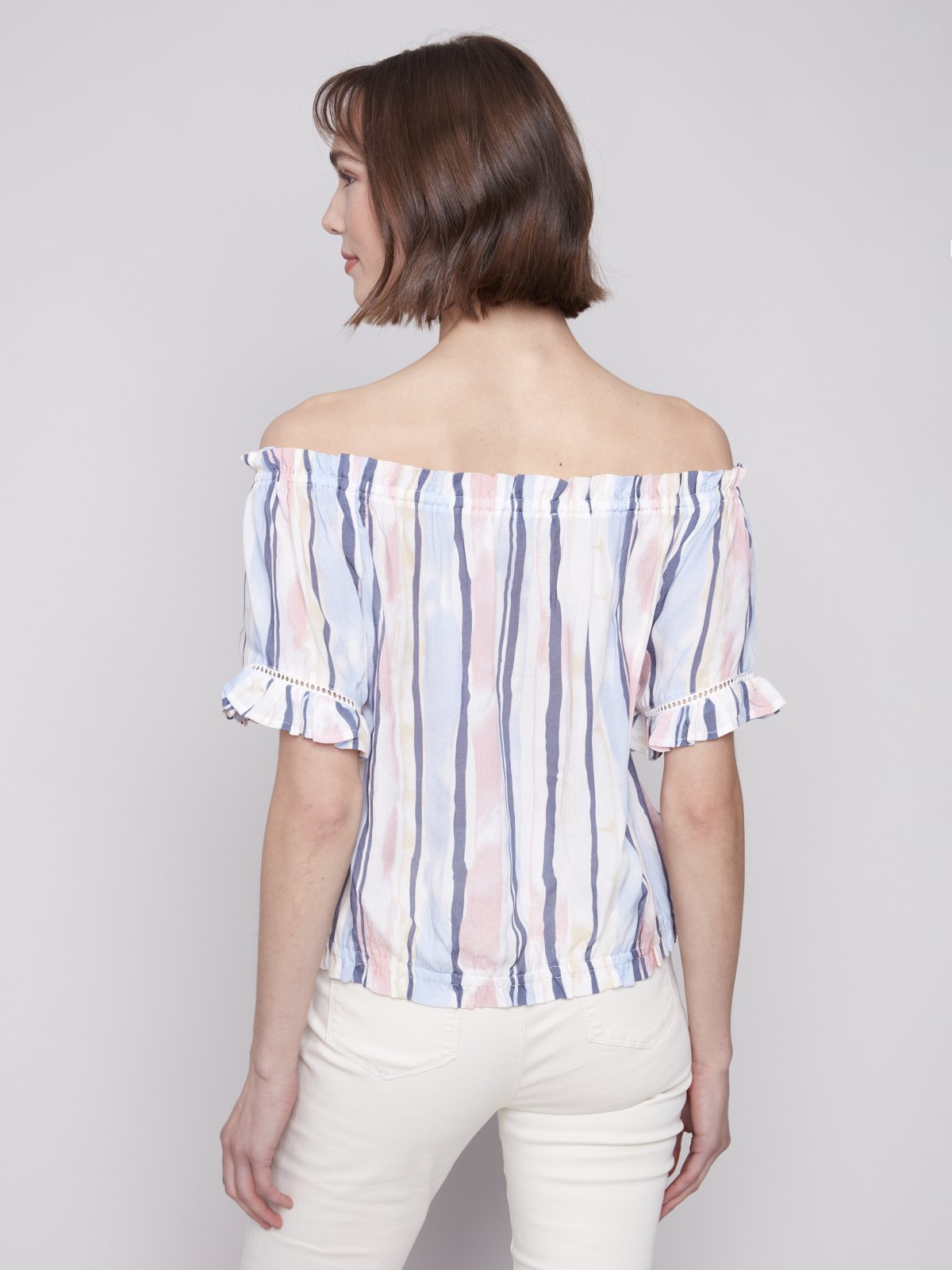 Stylish pink and blue striped top for women, perfect for coastal boutique clothing and tropical vacations.