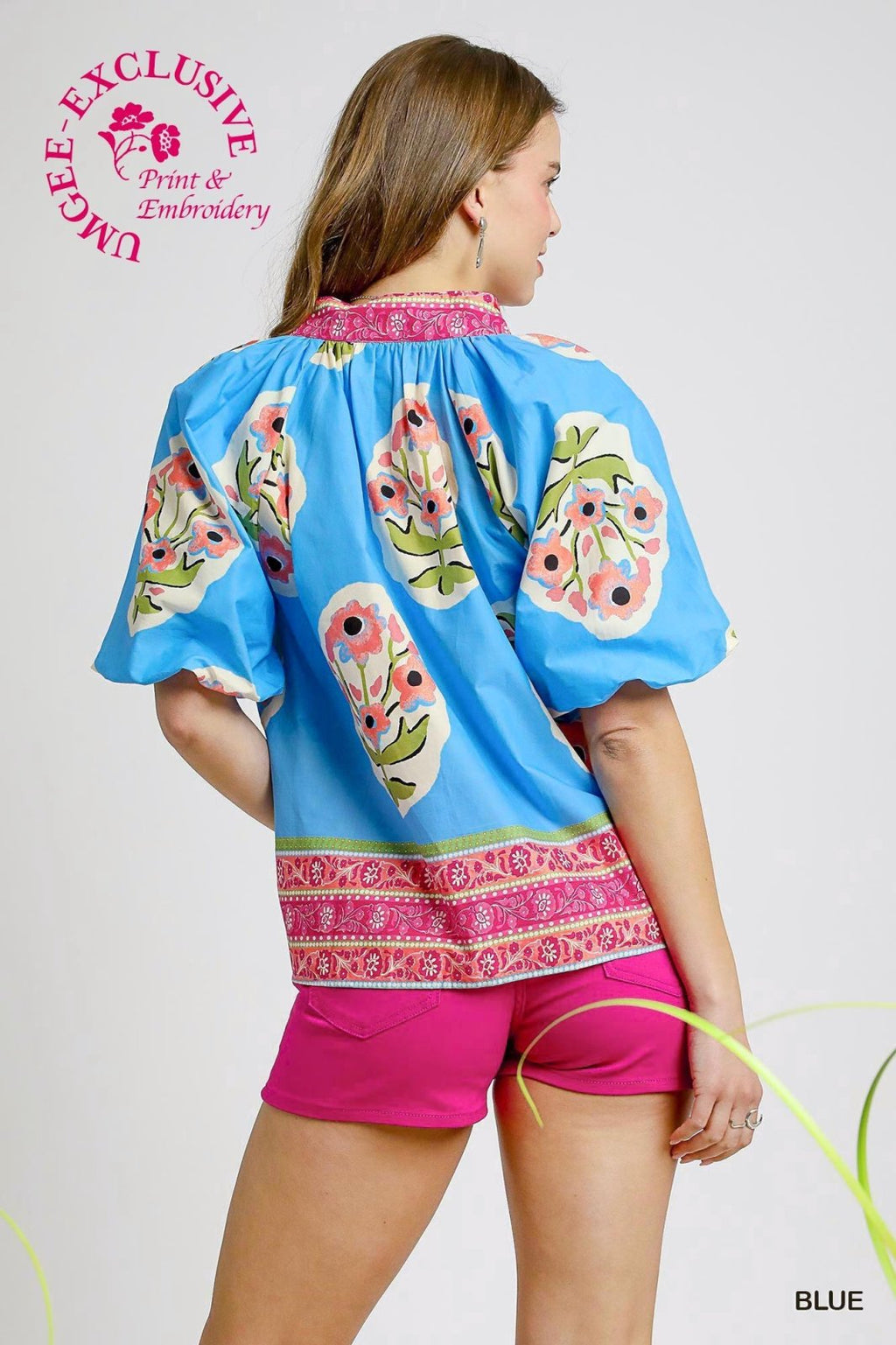 Plus size blue floral top with short sleeves, perfect for coastal boutique clothing and stylish tops for women.