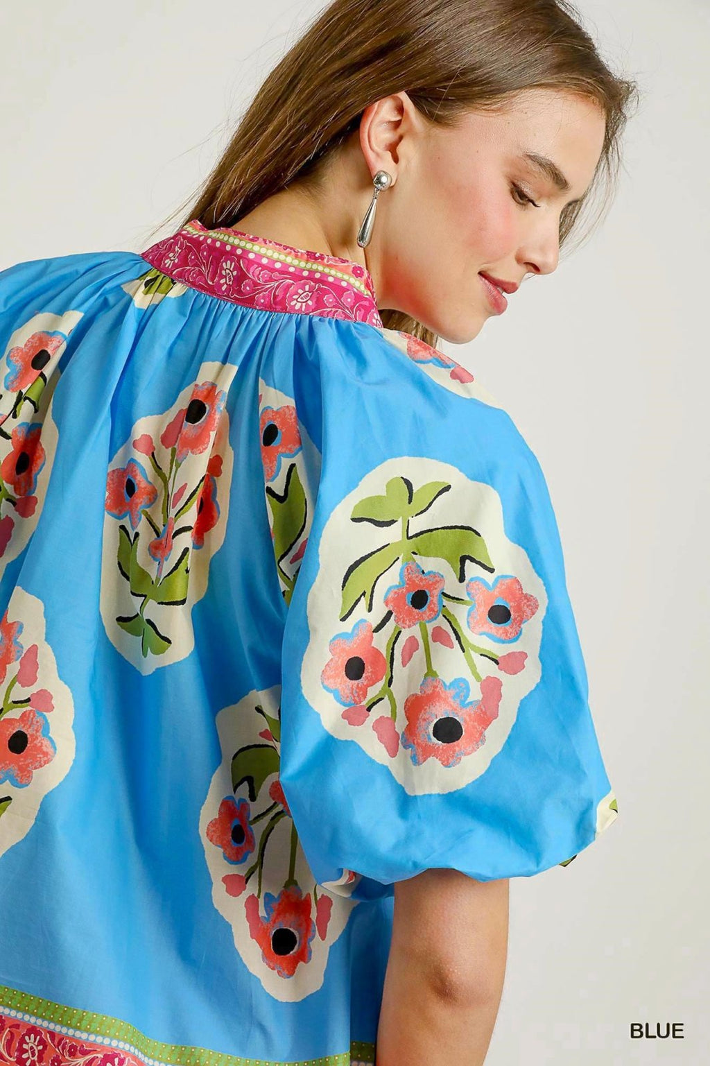 Blue floral plus size top from Port Aransas boutique, perfect for stylish summer outings and tropical vacations.