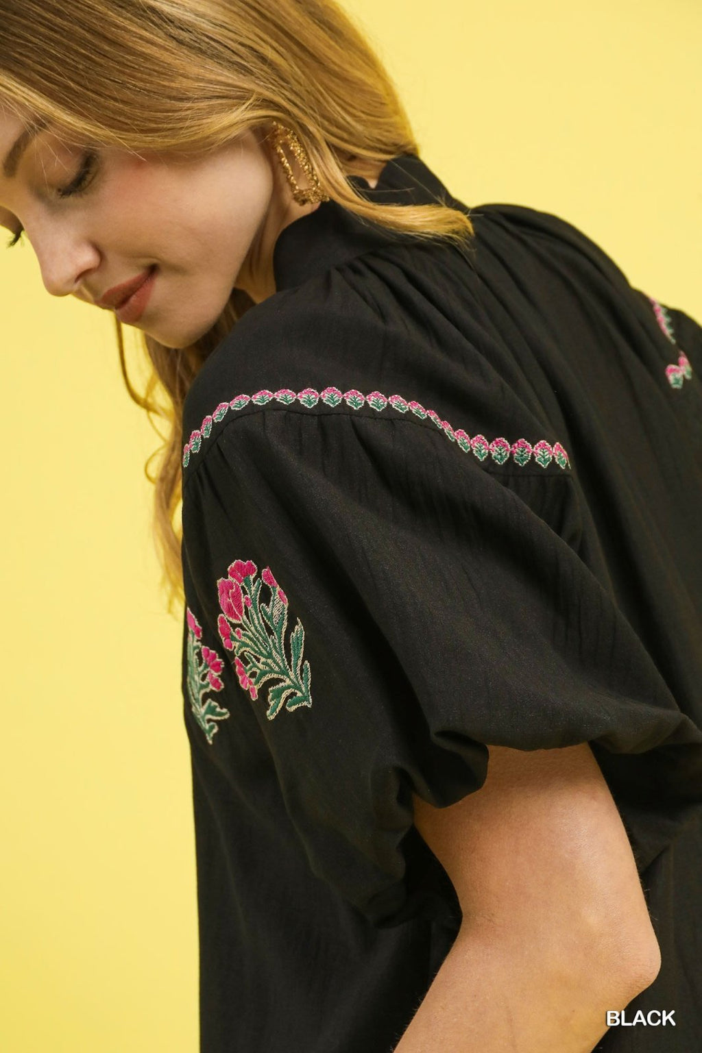 Black floral embroidered puff sleeve blouse showcasing vibrant embroidery, perfect for coastal boutique clothing and stylish tops for women.