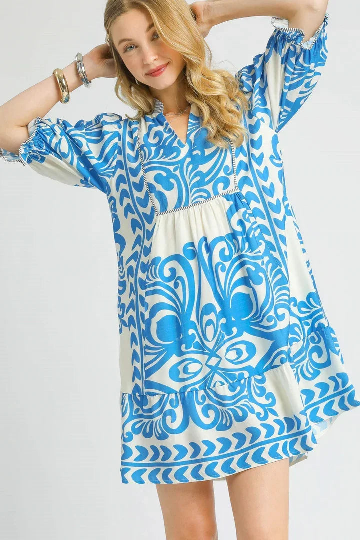 Isabella Dress: Stylish two-tone print mini dress, perfect for coastal boutiques and tropical vacations. Curated women's fashion.