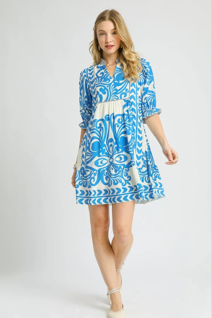 Isabella Dress: Stylish mini dress with blue print, perfect for coastal boutique clothing and beach dresses.