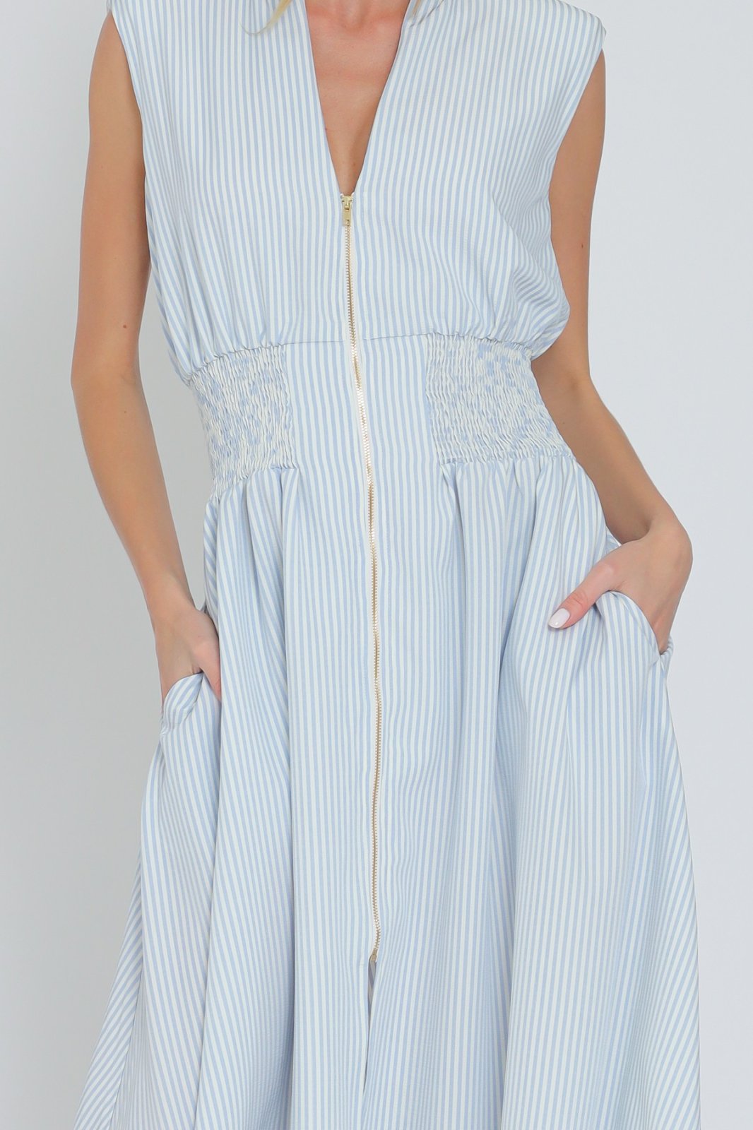 Catherine Dress in light blue with white stripes, stylish smocked waist, perfect for coastal boutique clothing and tropical vacations.