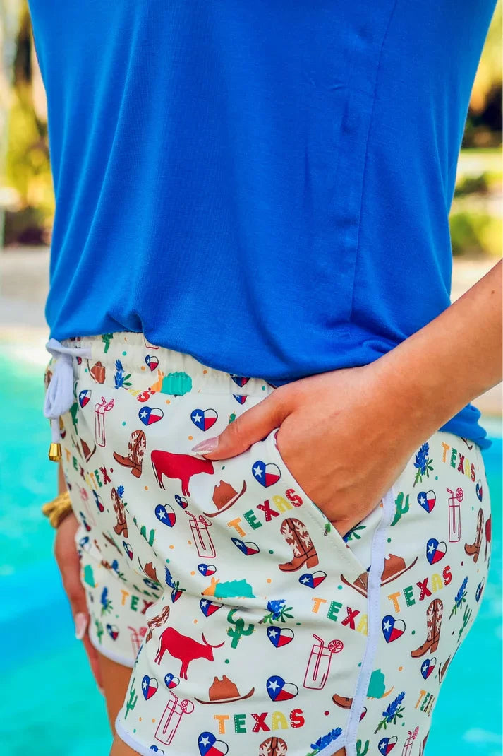 All Things Texas Drawstring Shorts styled with a blue top, perfect for summer outfits Texas at Raggdoll Boutique.