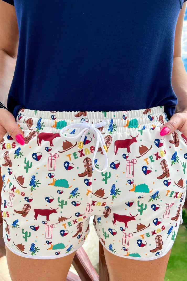 All Things Texas Drawstring Shorts featuring fun Texas print, perfect for summer outfits at Raggdoll Boutique.