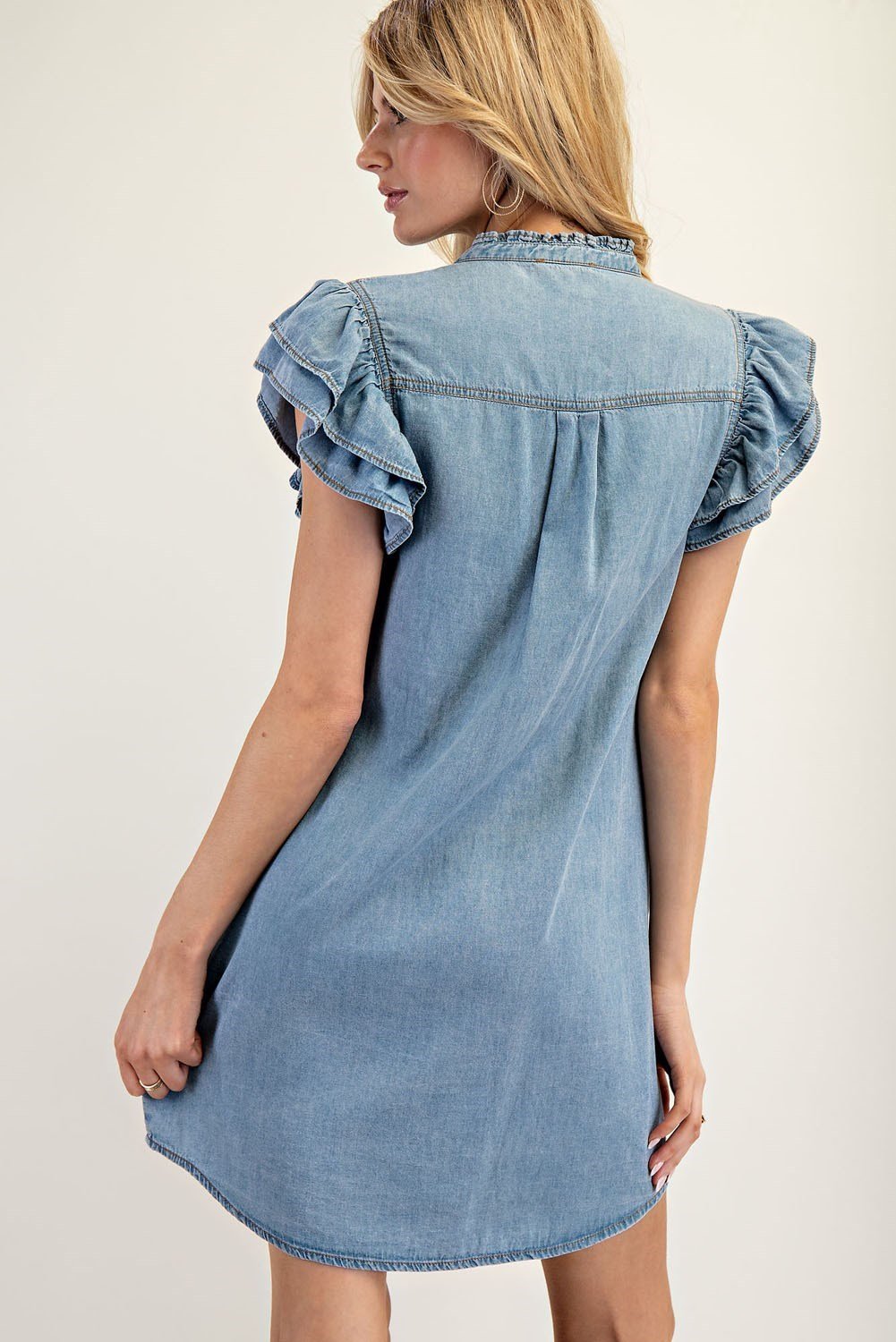 Stylish chambray mini dress with layered ruffle sleeves, perfect for coastal boutique clothing and beach-style outfits.