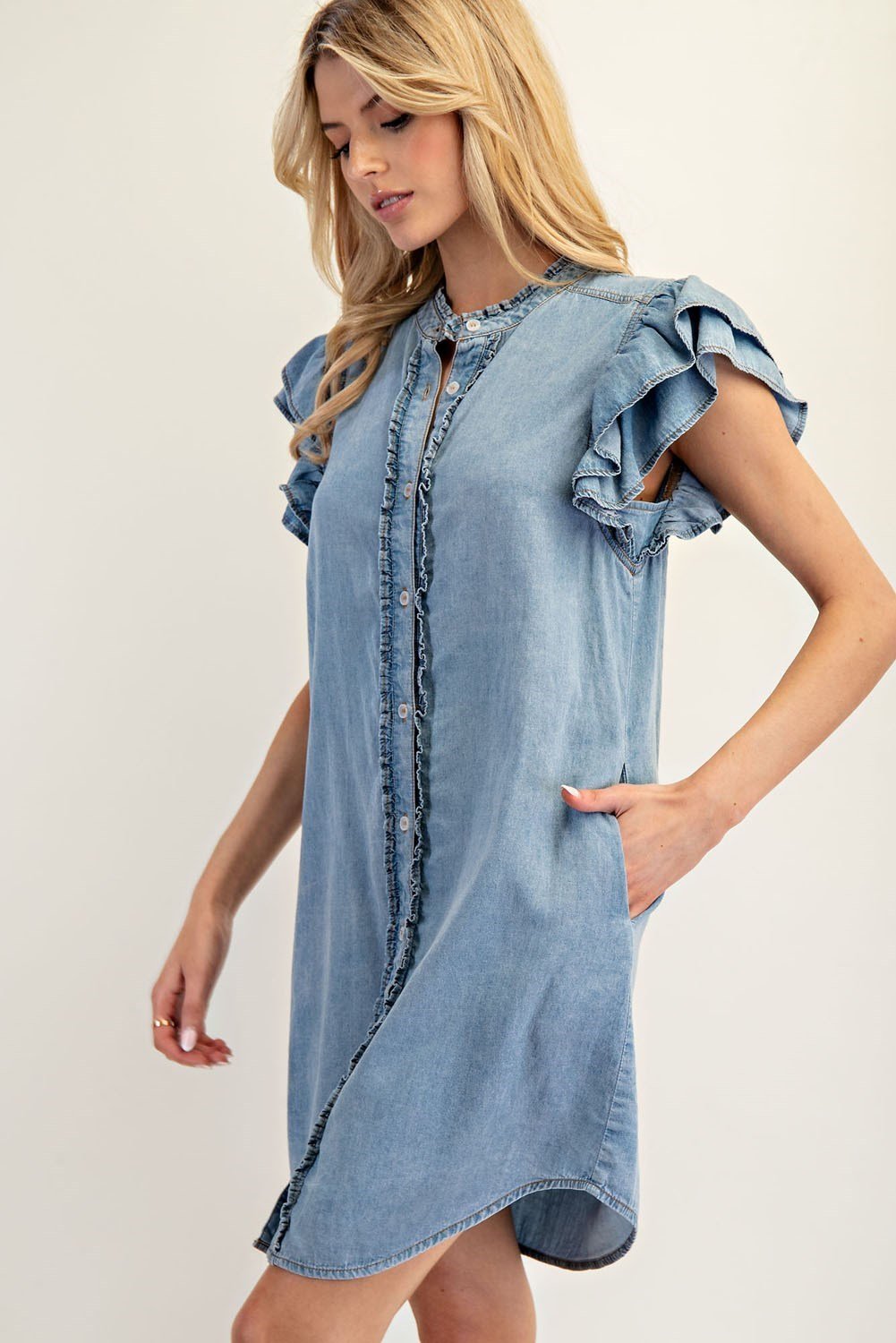 Stylish chambray mini dress with layered ruffle sleeves, perfect for coastal boutique clothing and tropical vacation dresses.