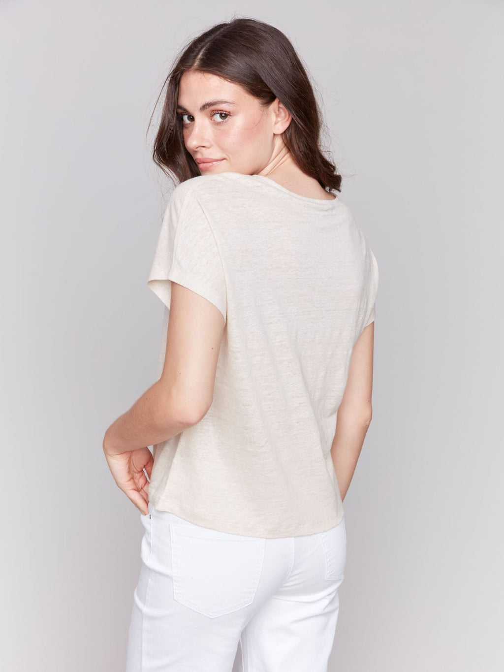 Champagne Gold Dolman Sleeve Top worn by a model showcasing its stylish back view at Raggdoll Boutique.