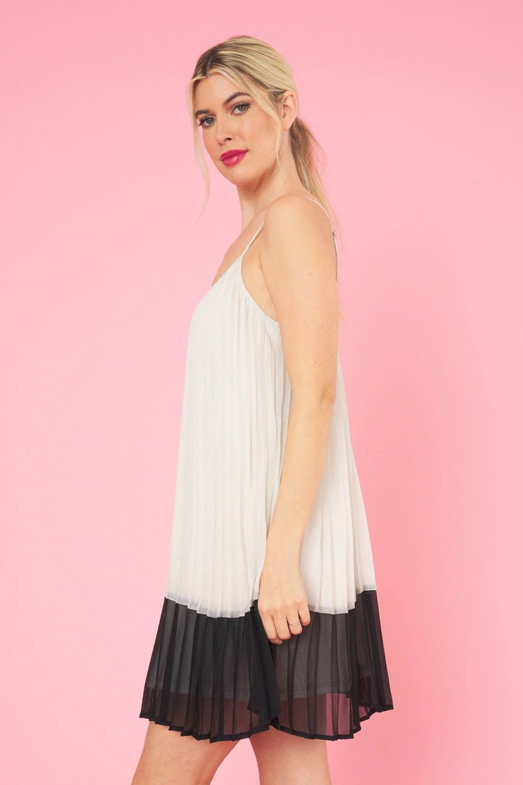 A. HEPBURN DRESS from Raggdoll Boutique, featuring a trendy coastal style with a chic pleated design.