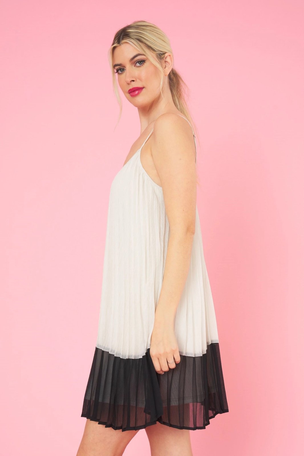 A. HEPBURN DRESS from Raggdoll Boutique, featuring a trendy coastal style with a chic pleated design.