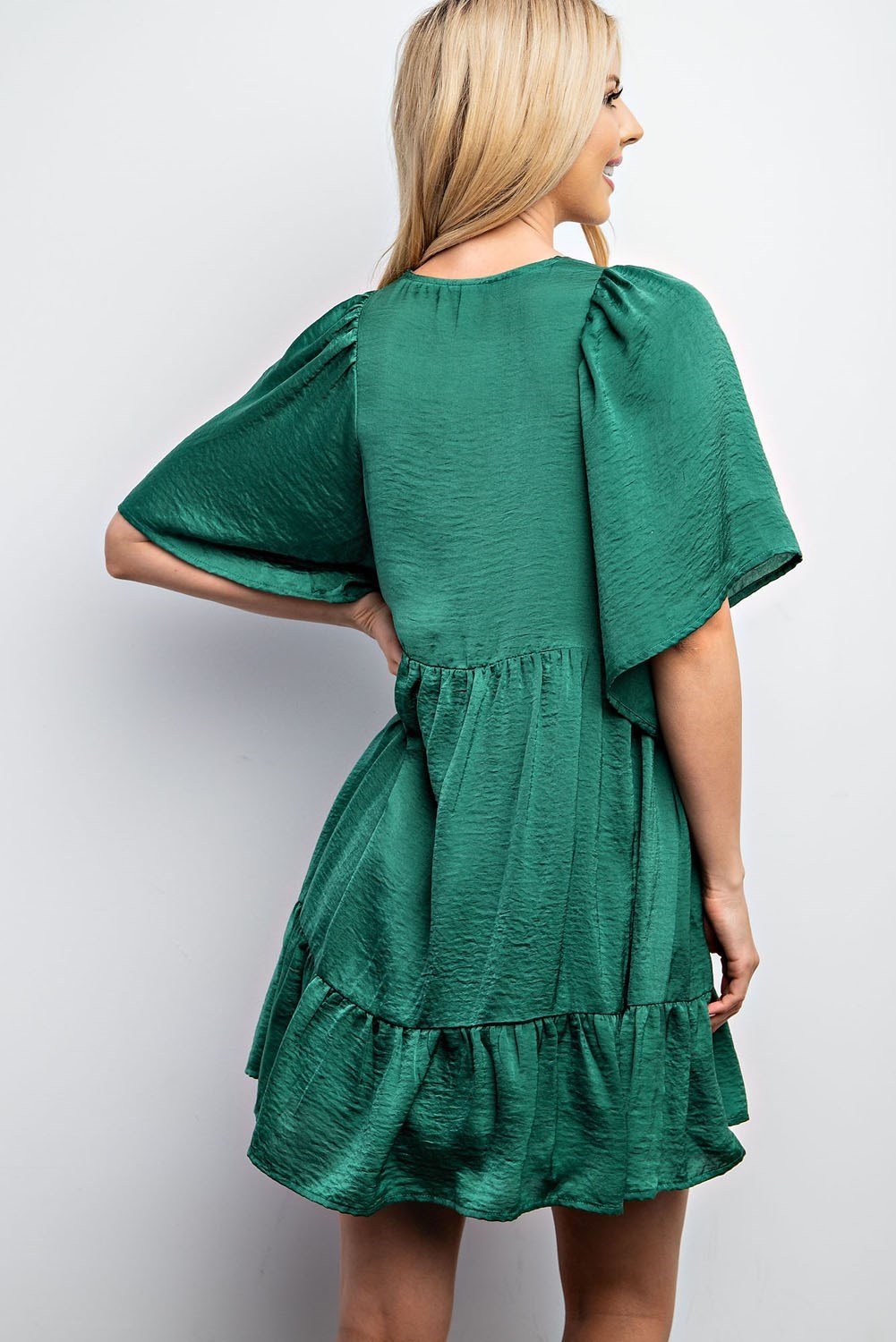 DRESS FOR THE HOLIDAYS in vibrant green from Raggdoll Boutique, perfect for vacation wardrobe and summer outfits Texas.