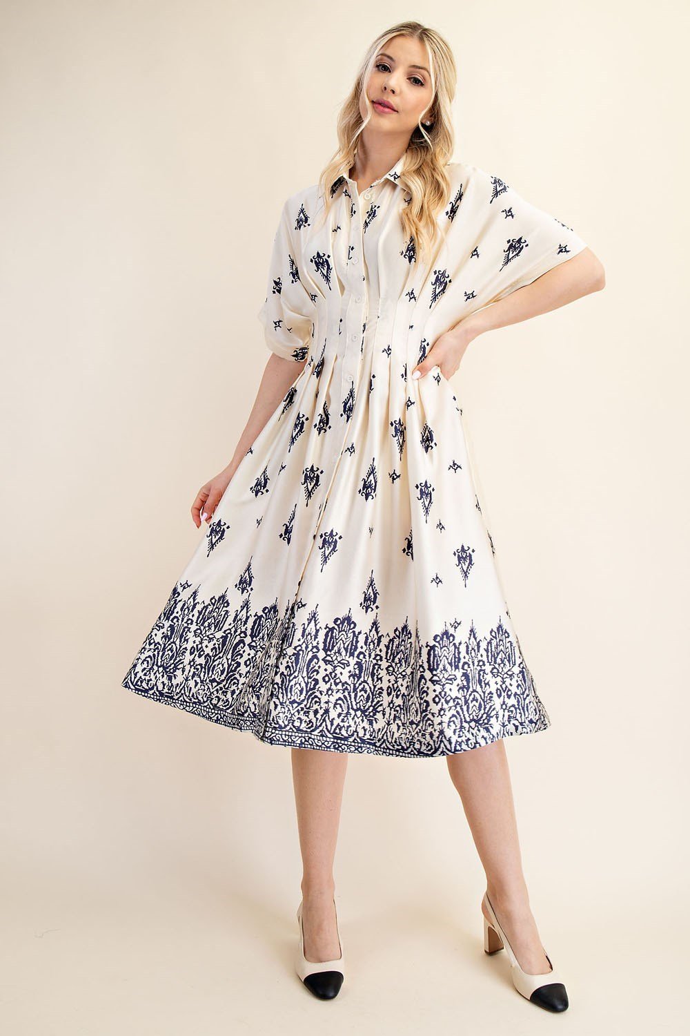 Liza Dress from a Port Aransas boutique, featuring a stylish navy border print, perfect for coastal outings and women's fashion.