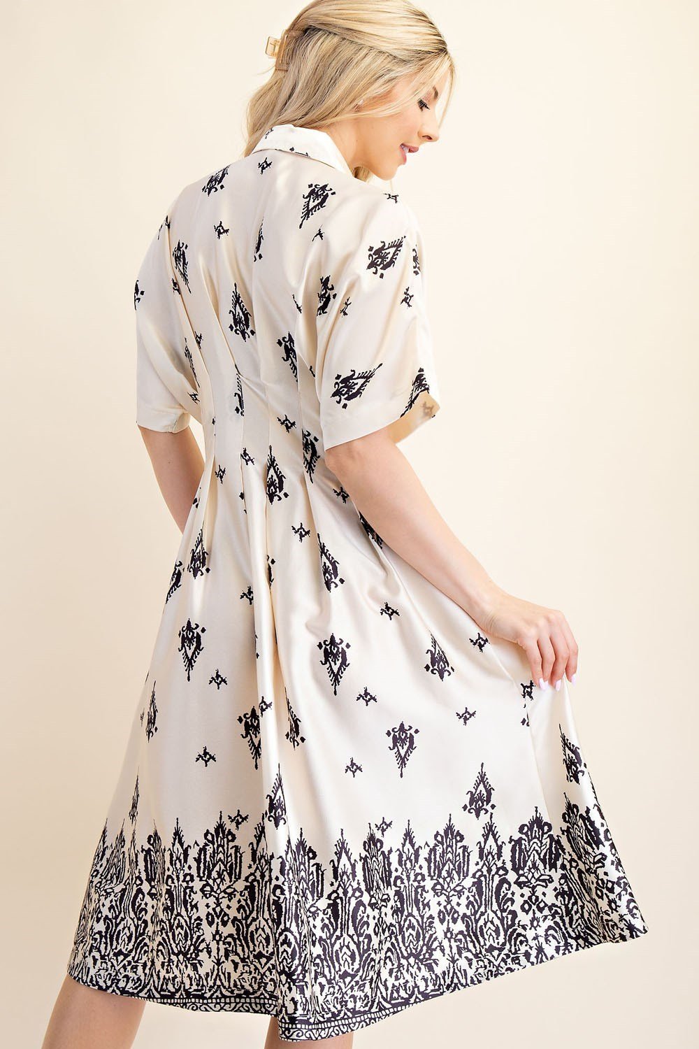 Chic silk midi dress with elegant print, perfect for coastal boutique clothing and tropical vacation styles.
