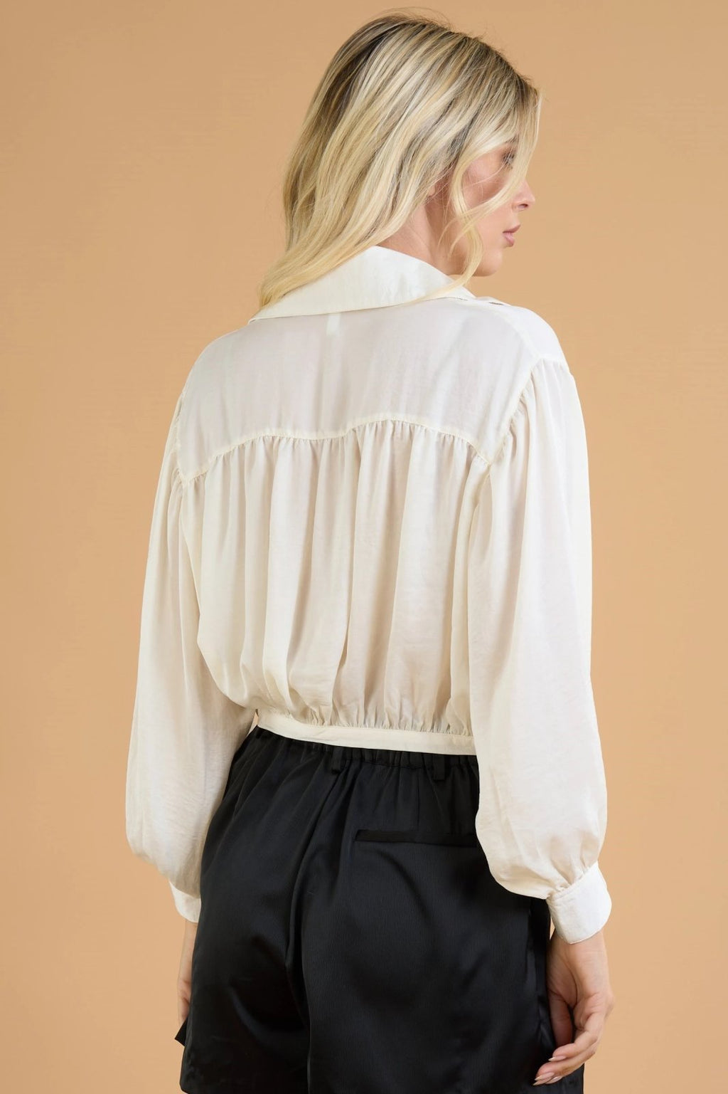 Back view of CREAM TIE-FROMT SATIN TOP from Raggdoll Boutique, showcasing trendy coastal style and summer outfits Texas.