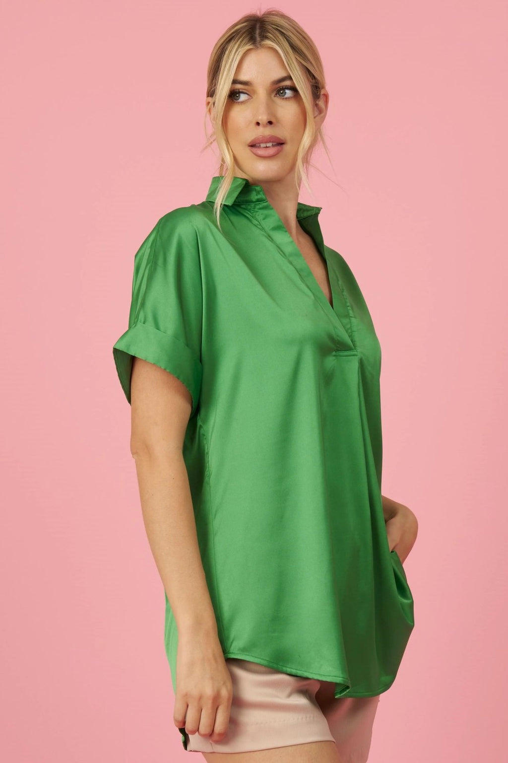 Model wearing KELLY GREEN COLLARED SATIN TOP from Raggdoll Boutique, perfect for trendy coastal style.