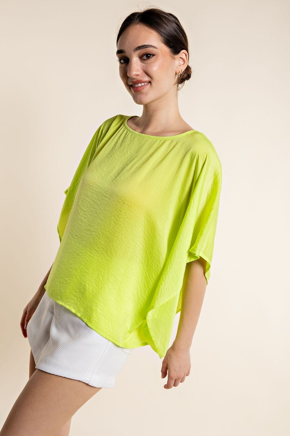 LIME SATIN TOP worn by a model, featured at Raggdoll Boutique, perfect for summer outfits Texas.