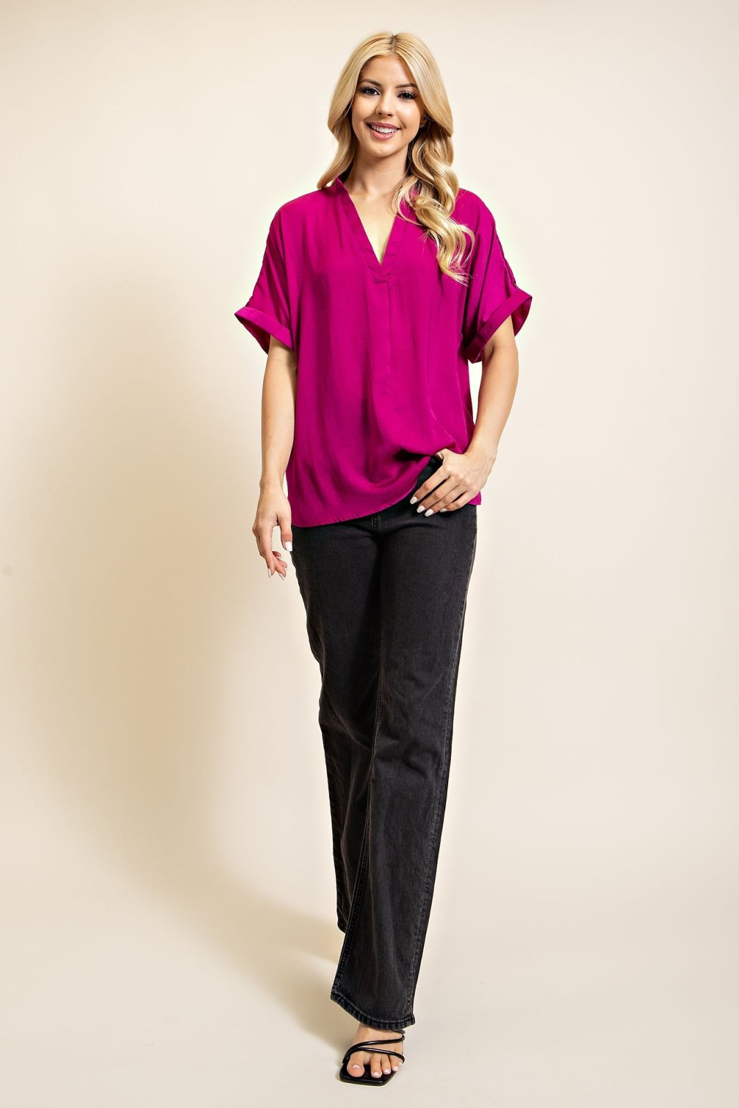 Stylish plum satin hi-lo top paired with black bottoms, ideal for coastal boutique clothing and trendy beach dresses.